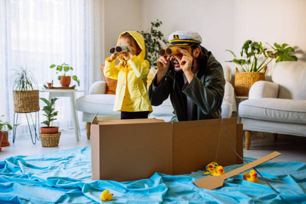 father playing exciting adventure game with daughter - fishing nautical vessel small men imagens e fotografias de stock