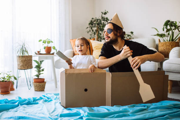 istock Father Playing Exciting Adventure Game With daughter 1300904333