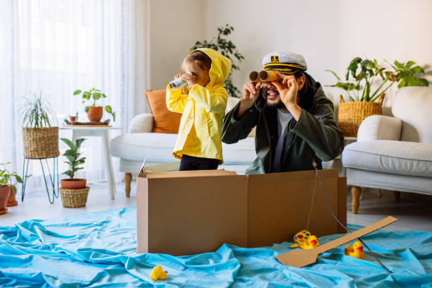 father playing exciting adventure game with daughter - fishing nautical vessel small men imagens e fotografias de stock