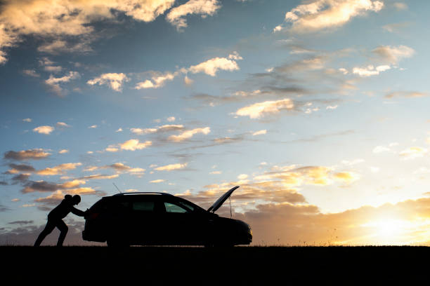 istock Unrecognizable Man Having Car Trouble At Sunset 1300906207