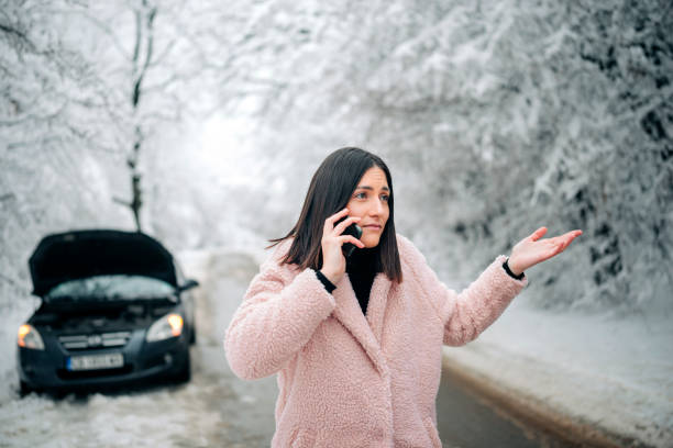 istock Woman Calling for help, her car broke! 1300906218
