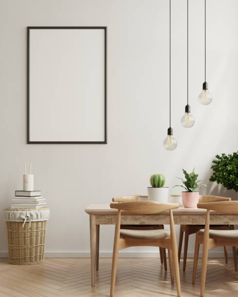 istock Mock up poster in modern dining room interior design with beige empty walls. 1300910356