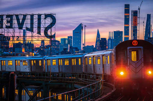 The 7 Train enters Queensboro Plaza in Queens, NYC. USA.