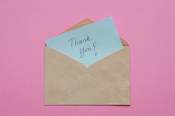istock Thank you card or note, hand written inside brown envelope. 1300914171