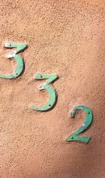 Number 332 Street Address on Adobe Wall