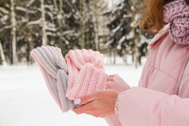 istock Knitted women's headbands of different colors in hands 1300920751