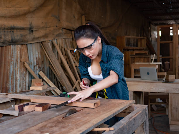 istock pretty hardworking carpenter woman at workplace 1300922652