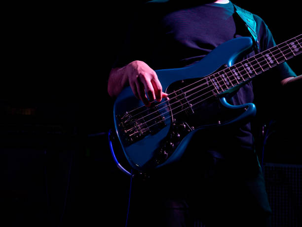 istock Musician plaing guitar in concert. 1300923455