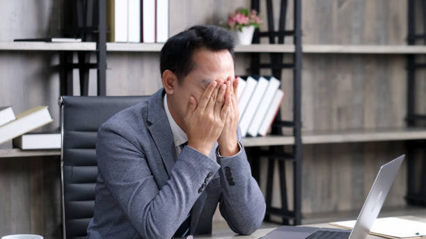 istock Asian businessman with frustrated and depressed expression while working office desk, office lifestyle 1300927023