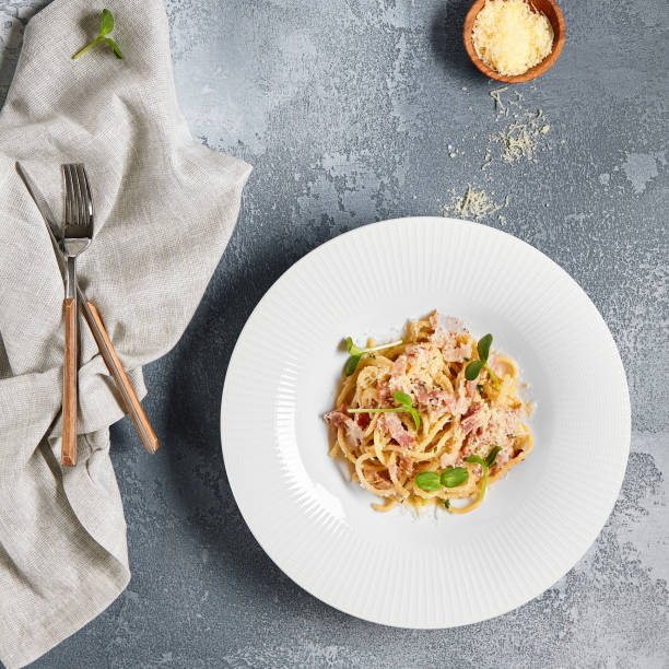istock Pasta Carbonara with Bacon and Microgreens 1300928066