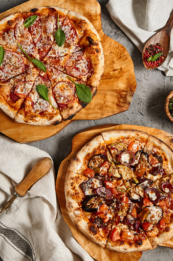 BBQ and Pepperoni Pizzas top view. Rustic Style with Spices. Overhead on wooden tray