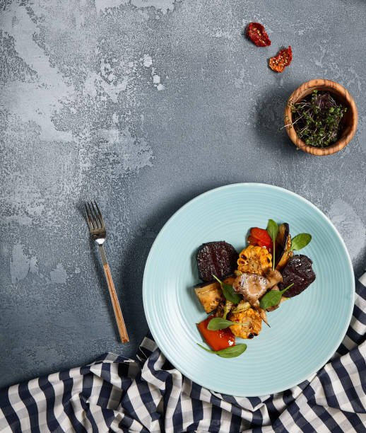 istock Grilled vegetables on blue plate 1300928080