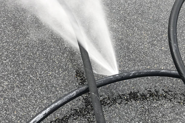 istock Punctured hose and high-pressure water leak 1300929578