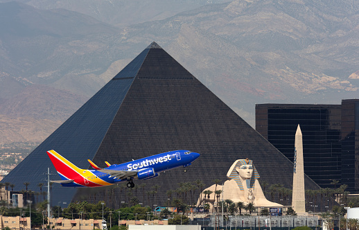 Las Vegas, Nevada, USA - April 21, 2016: A Southwest Airlines Boeing 737 takes off from McCarran International Airport with the Luxor hotel in the background.