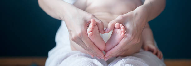 Baby feet in mother hands