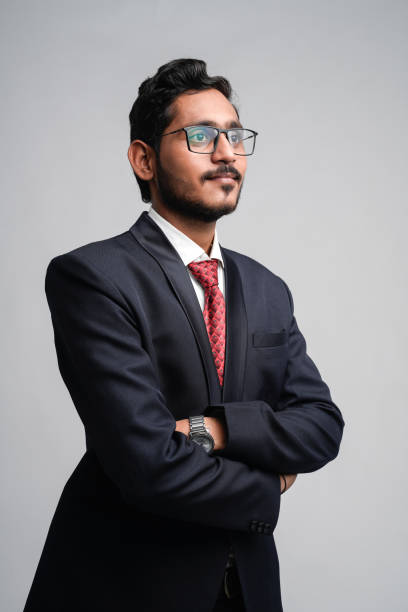 istock Successful Young indian business man posing over white background 1300932601