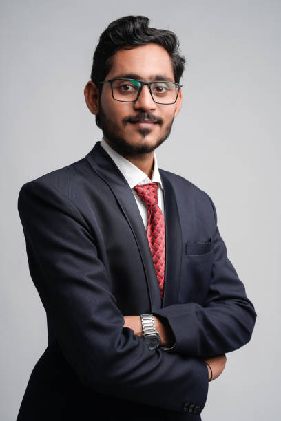 istock Successful Young indian business man posing over white background 1300932602
