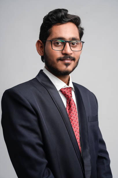 istock Successful Young indian business man posing over white background 1300932614