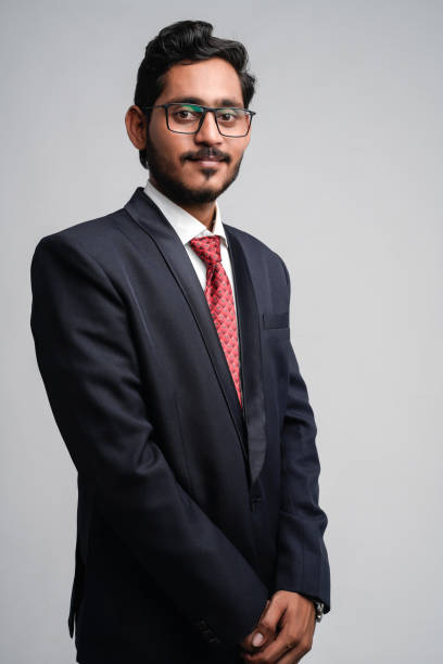 istock Successful Young indian business man posing over white background 1300932619