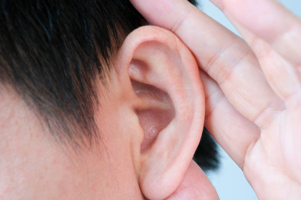 istock The young man touched his ear and he had a sore ear. 1300935330