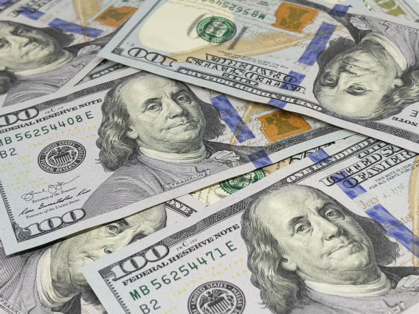 istock US Currency Hundred Dollar Bank Note Background 1300938447