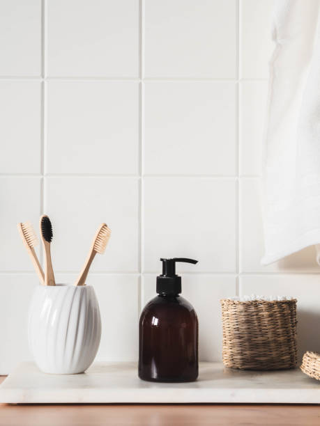 istock White bath background front view with cosmetic bottle and bath accessories 1300939274
