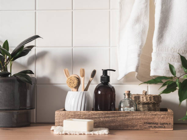 istock White bath background front view with cosmetic bottle and bath accessories 1300939275
