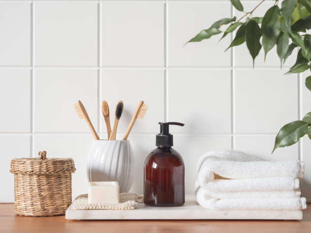 istock White bath background front view with cosmetic bottle and bath accessories 1300939281