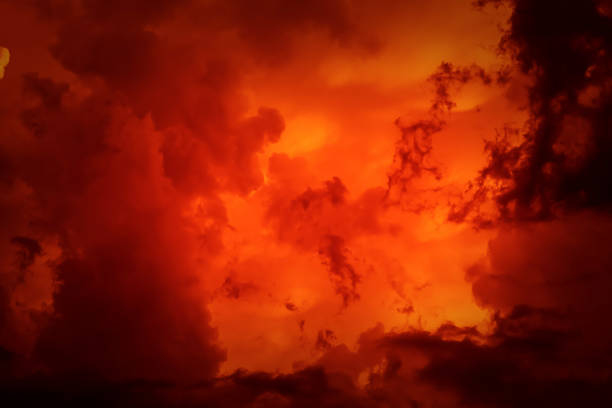 istock Fantastic concept mystical horror background from another planet from the paranormal world, fantasy style. Dramatic red black orange sky with scary hellish clouds and terrible shadows and light 1300939359