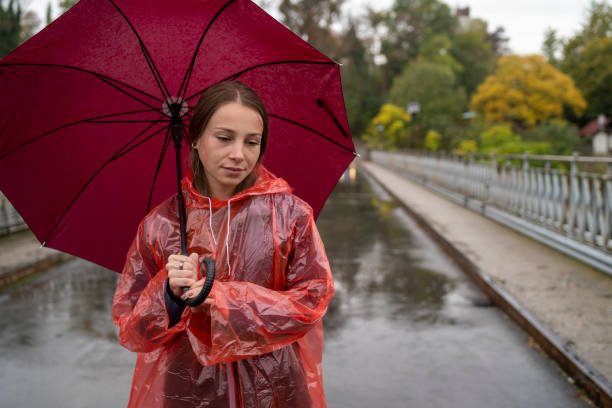 istock Woman standing on the rain 1300940306
