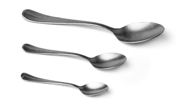 istock Set of silver spoons cutlery isolated on white 1300940418