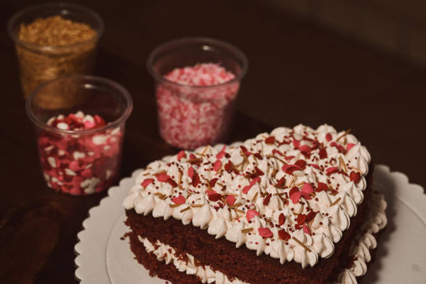 istock Heart-shaped red velvet cake 1300941124