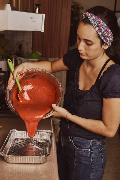 istock Woman pouring batter 1300941151