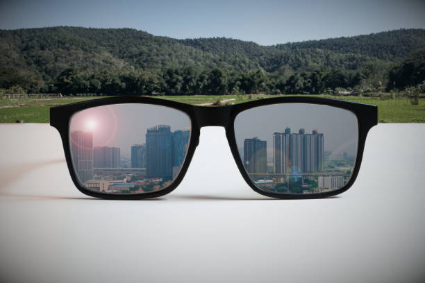 istock Abstract illustrations reflect the vision of a real estate developer.By reflecting the image of tall building construction through eyeglass lenses that see an undeveloped area. 1300941390