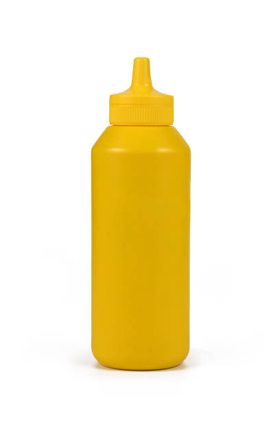 istock Yellow mustard squeeze bottle on white background 1300944116