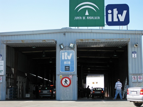 Cars having road worthiness tests at the vehicle testing station - ITV MOT, Estepona, Spain.
