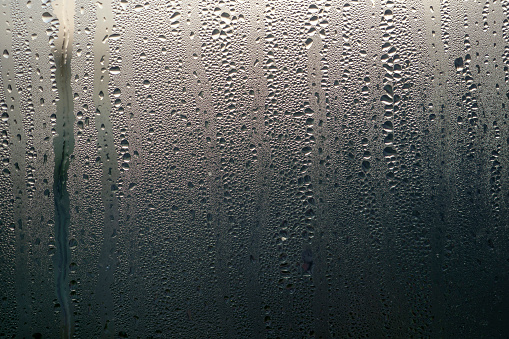 Texture. Condensation on the clear glass window. Water drops. Abstract background.