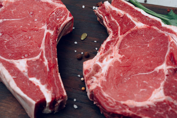 istock Raw beef meat fillet on wooden board 1300946998