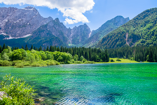 Fusine Lakes, two small lakes of glacial origin connected to each other by paths and located at the base of the Mangart mountain range