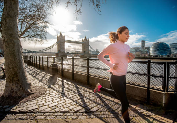 istock Jogging on sunny day by the waterfront in London 1300951752