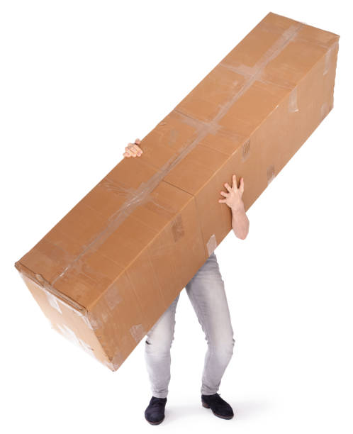 Man carrying a oversized cardboard box, isolated on white stock photo