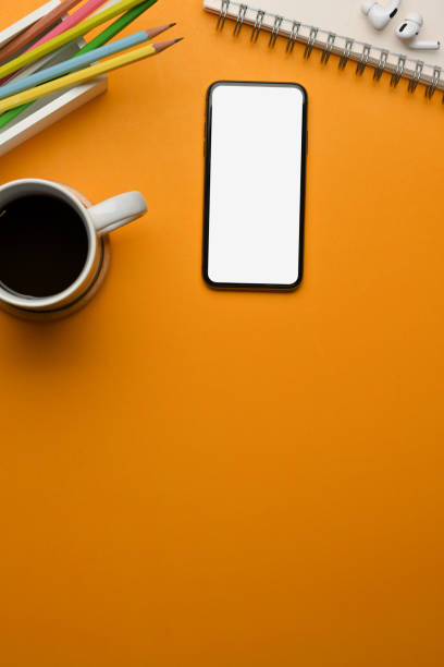 istock Workspace with smartphone, coffee cup, stationery and copy space in home office room 1300953422