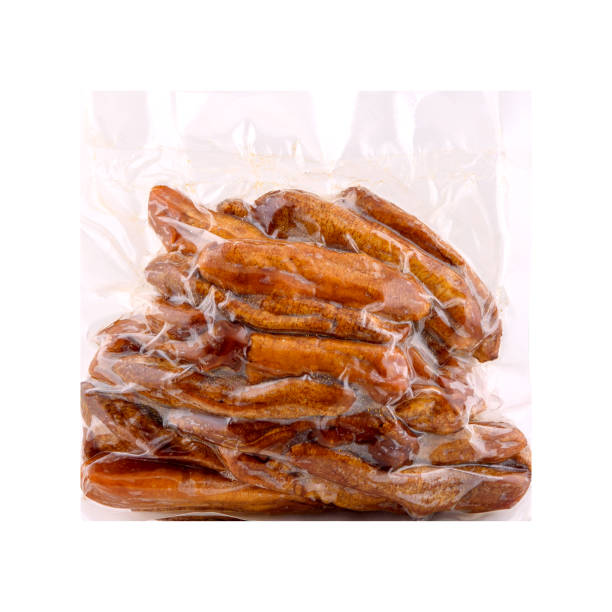 istock Dried bananas in vacuum plastic packaging isolated on white background, copy space. 1300954452