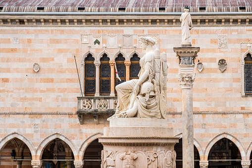 The nineteenth-century Peace Monument with, in the background, the Loggia del Lionello, the town hall of Udine