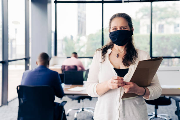 istock Businesswoman in office during COVID-19 1300958954