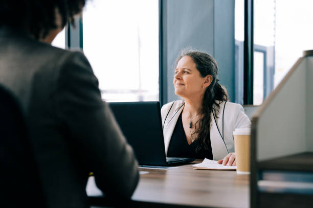 istock Mature female professional working at her desk 1300959382