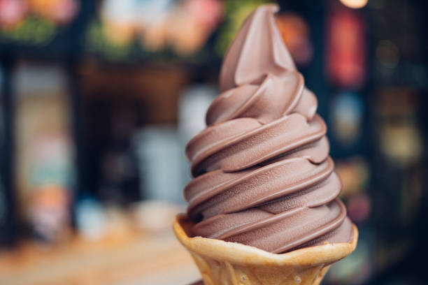 istock The soft chocolate ice cream with the wafer cone on blured bacground 1300960536
