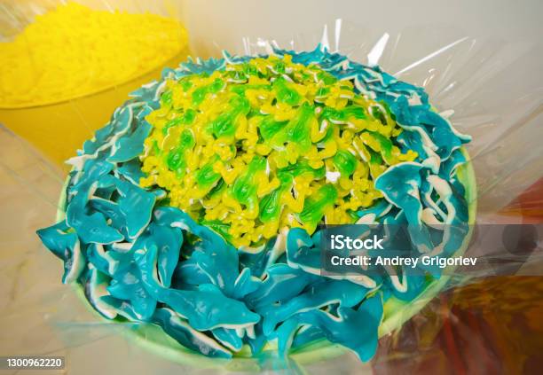 Green And Yellow Gummy Candy Frog And Blue Sharks Stock Photo - Download Image Now - Shark, Gummy Candy, Eating