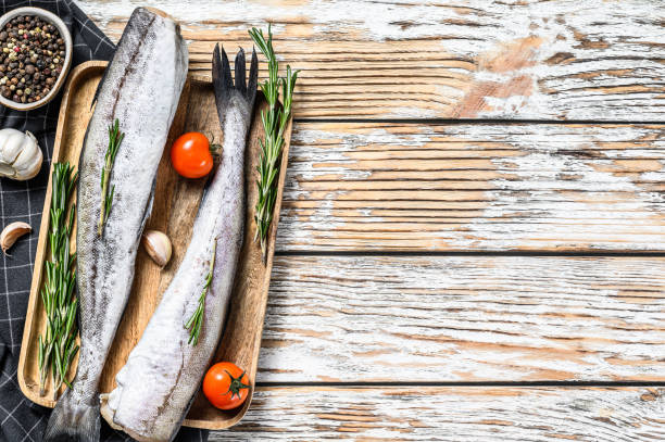 istock Whole fish Pollock. Raw seafood. White background. Top view. Copy space. 1300962569