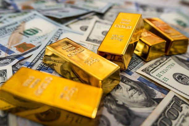 istock saving concept dollar bills and gold bar 1300963697